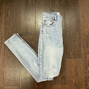 Reformation high waisted distressed skinny jeans.